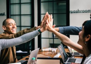 happy team of employees working together